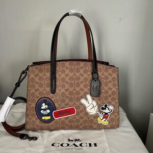 Disney X Coach Charlie Carryall
In Signature Canvas With Patches